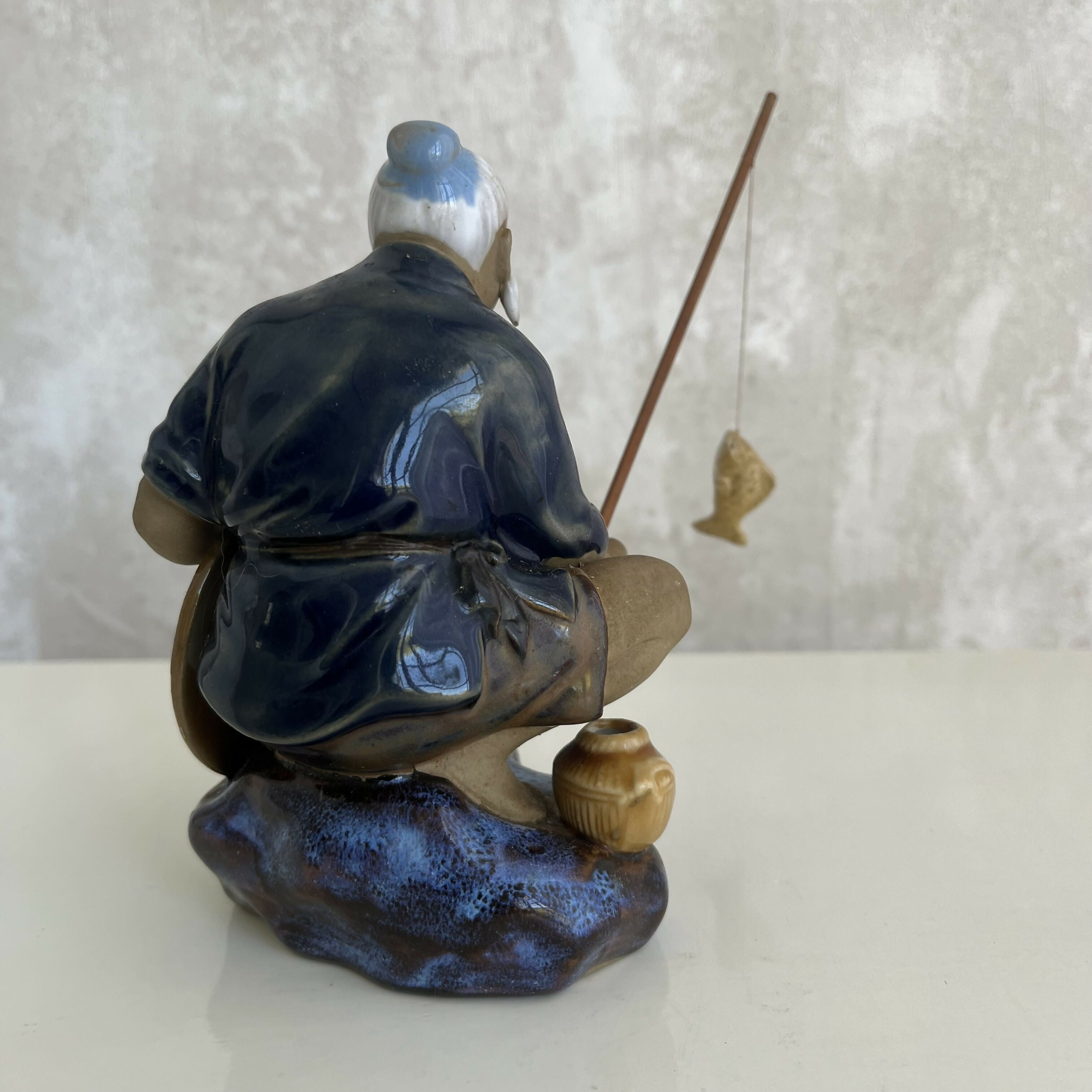 Estatueta de pescador chinês