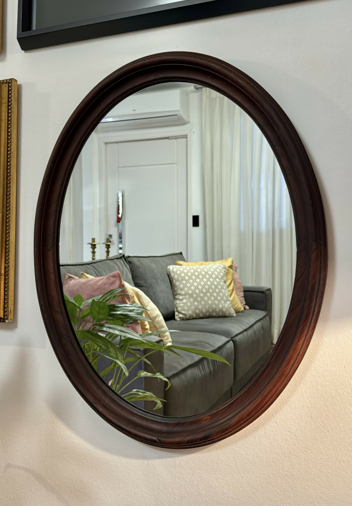 Espelho oval em jacarandá