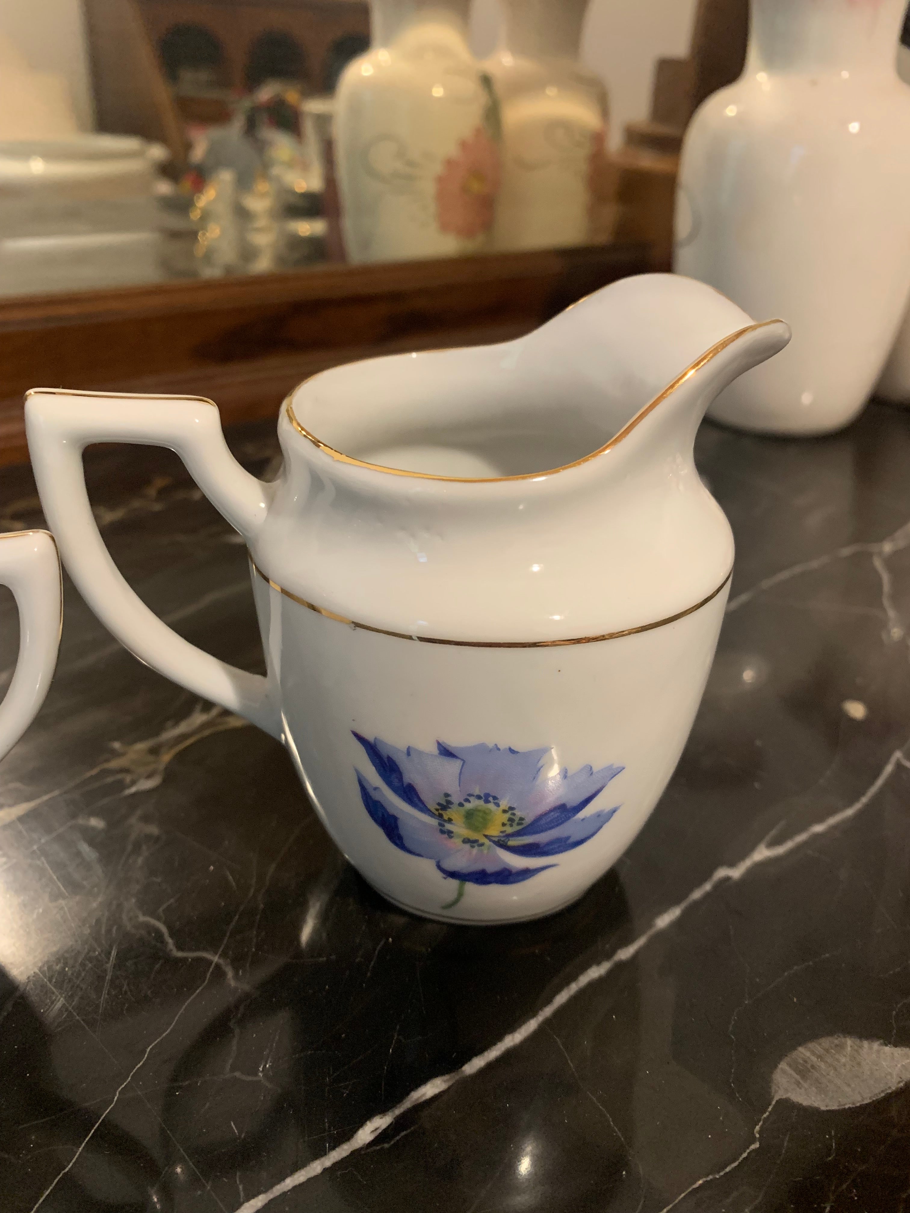 Conjunto de leiteira e açucareiro em porcelana São Pedro, dupla face