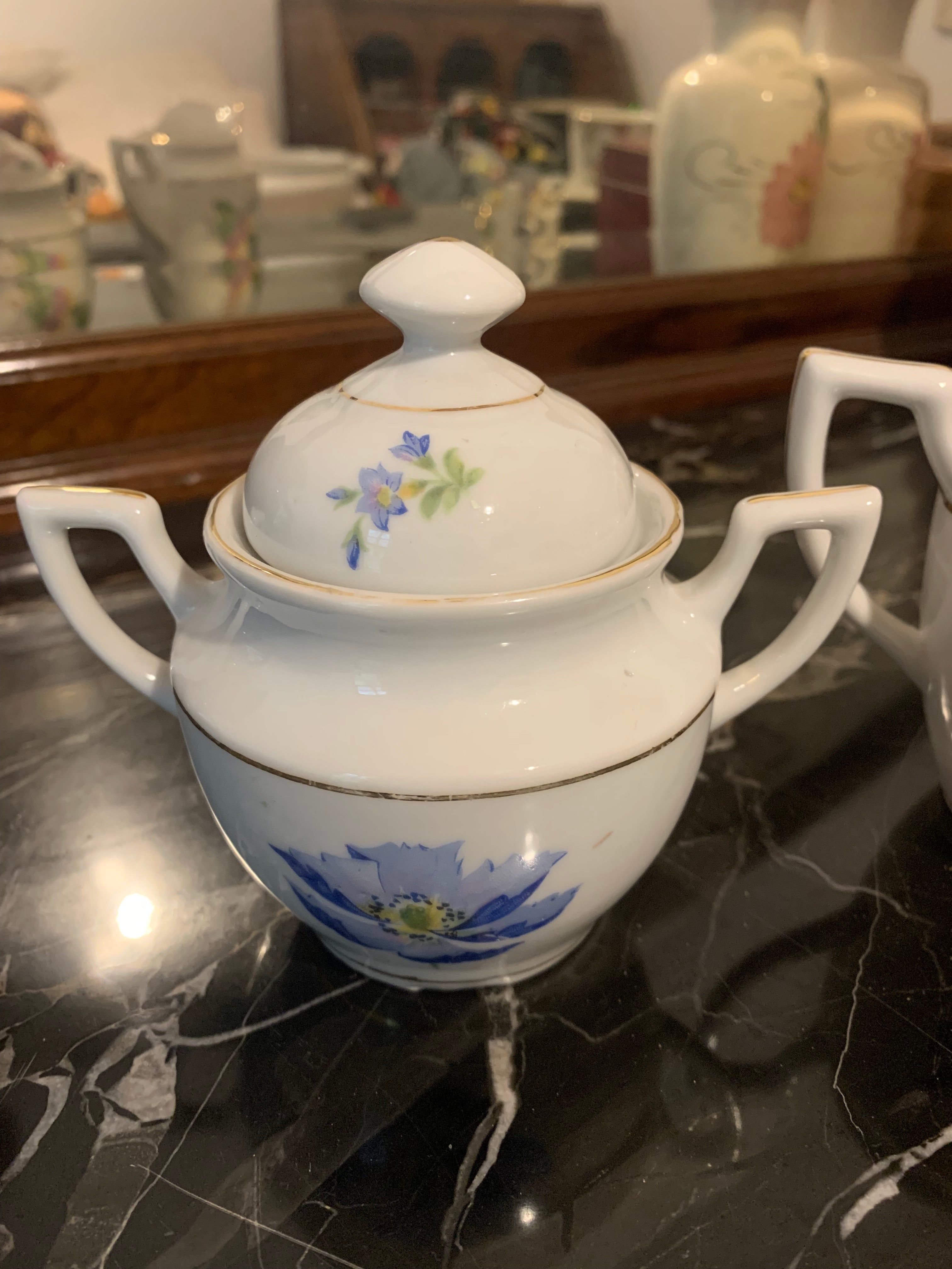Conjunto de leiteira e açucareiro em porcelana São Pedro, dupla face