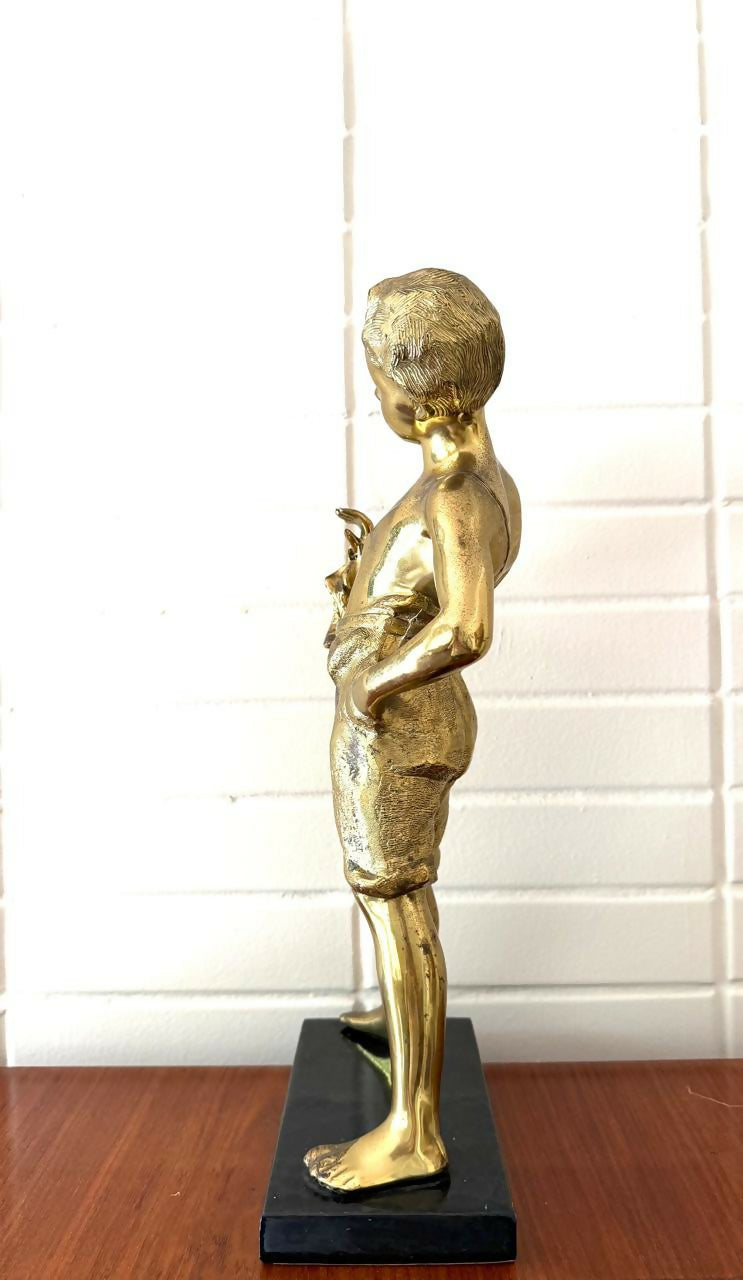 Escultura em PETIT BRONZE representando o menino da flauta