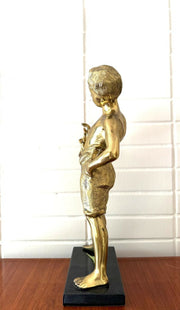 Escultura em PETIT BRONZE representando o menino da flauta