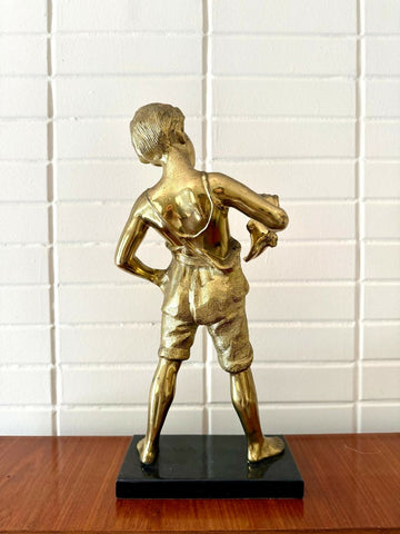 Escultura em PETIT BRONZE representando o menino da flauta