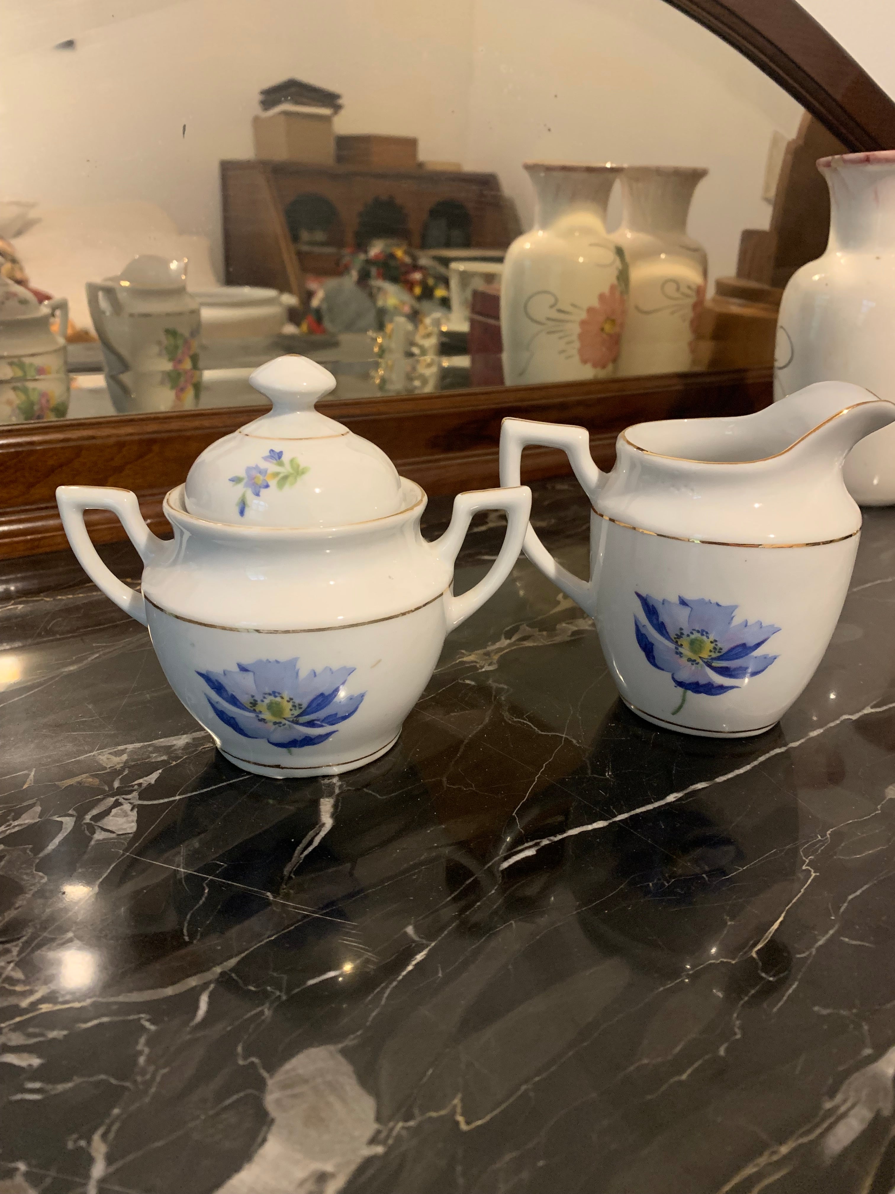 Conjunto de leiteira e açucareiro em porcelana São Pedro, dupla face