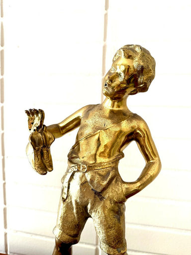 Escultura em PETIT BRONZE representando o menino da flauta