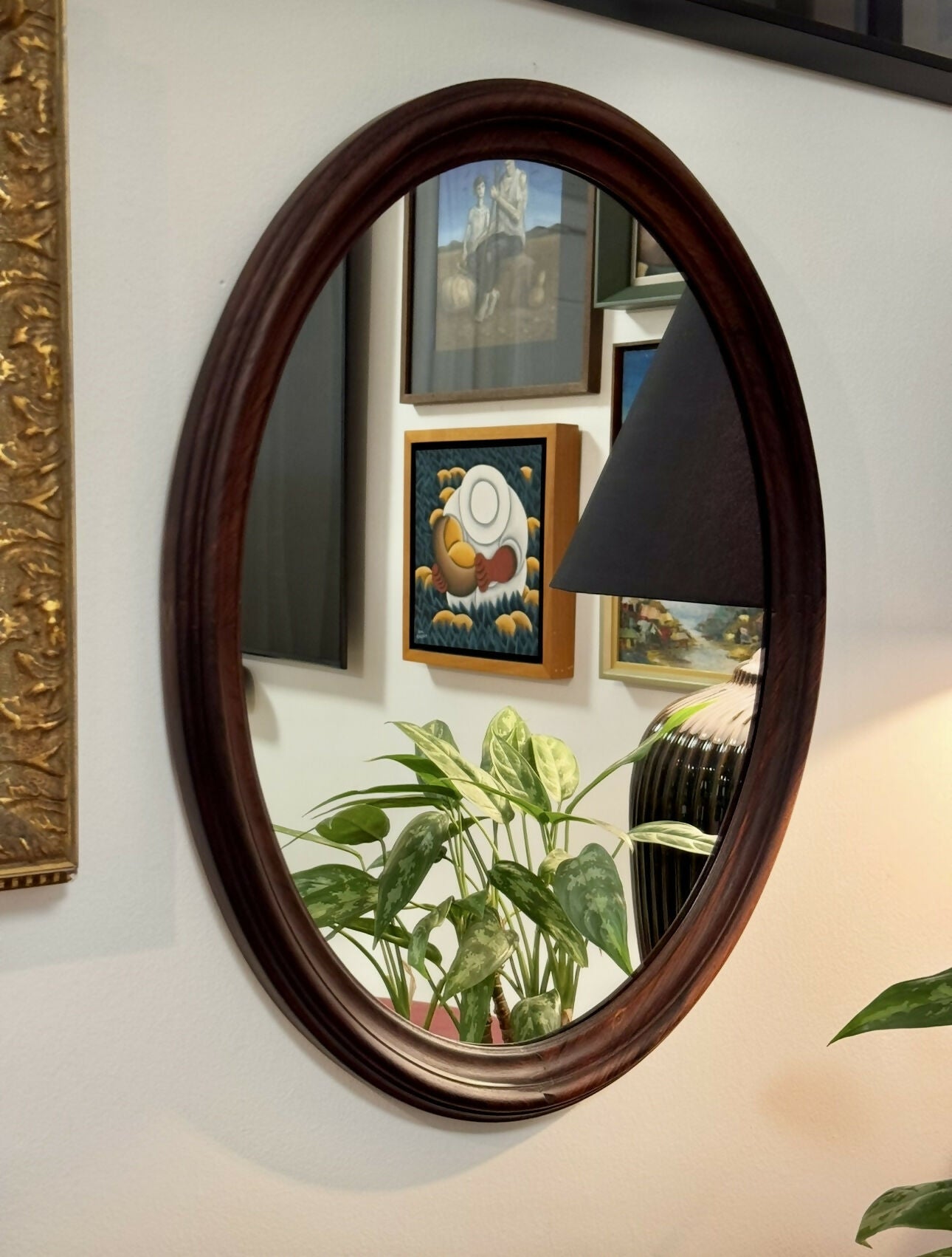 Espelho oval em jacarandá