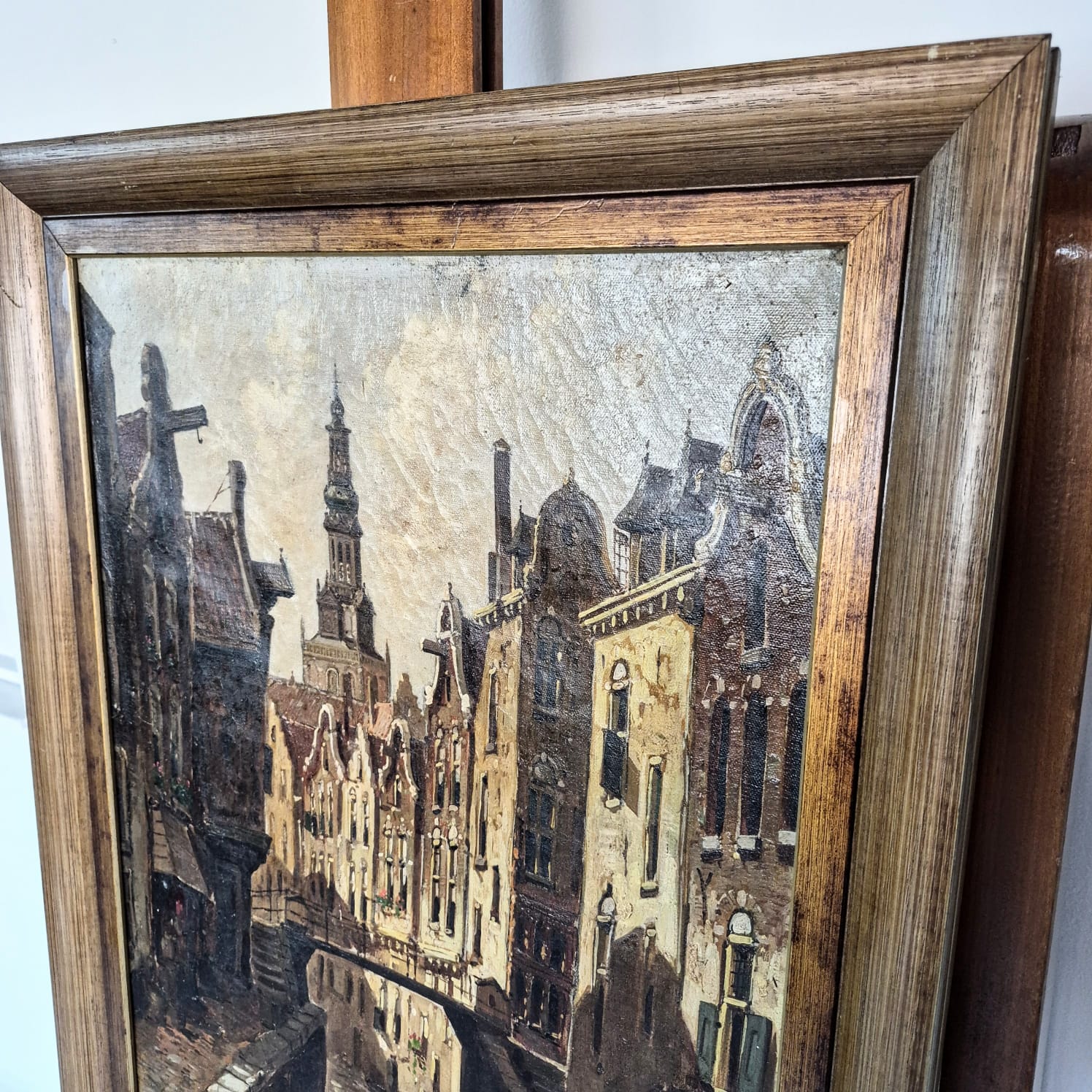 Quadro com pintura óleo sobre tela, atribuído a C. Shuyler, obra intitulada "Paisagem Urbana com Canal".