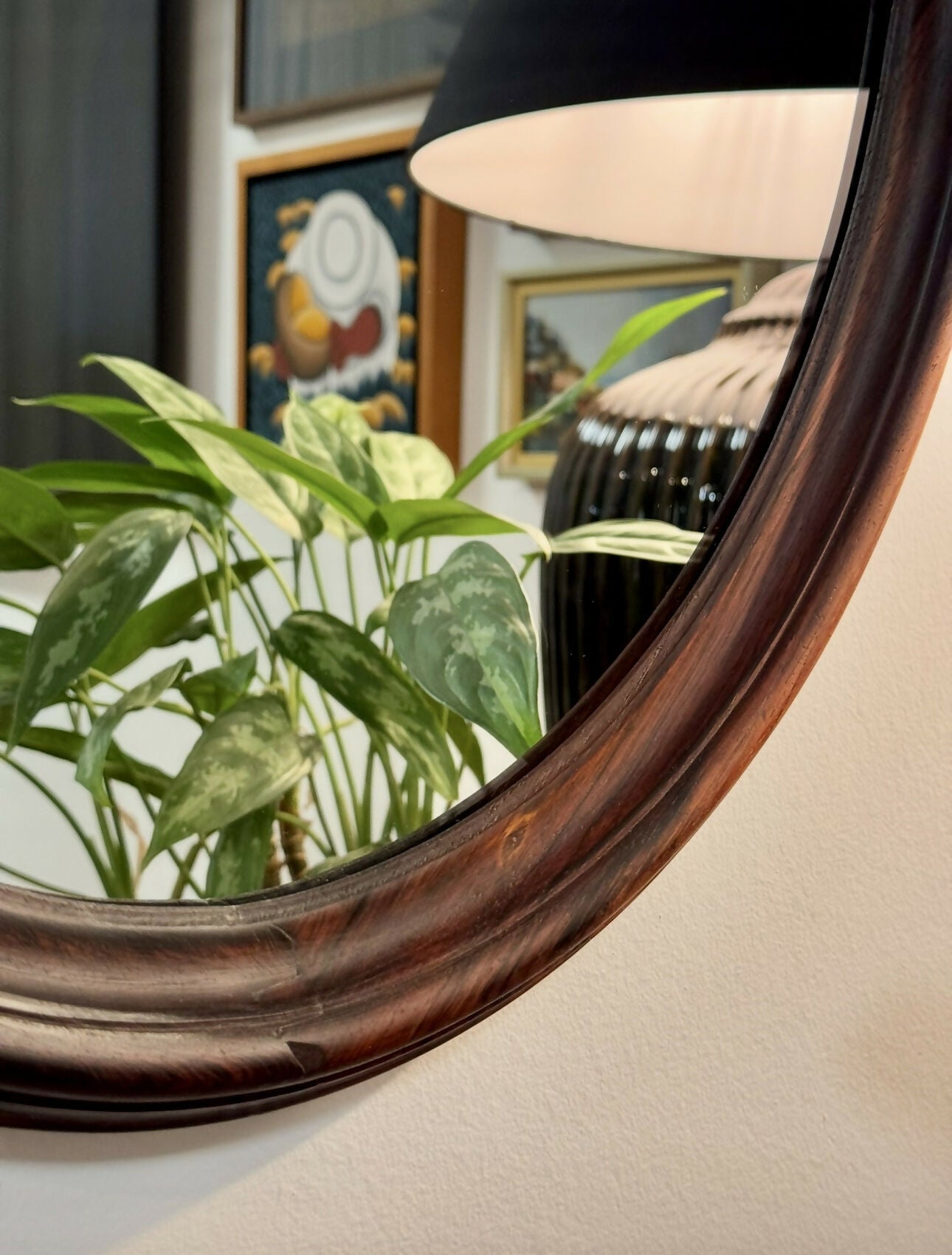 Espelho oval em jacarandá