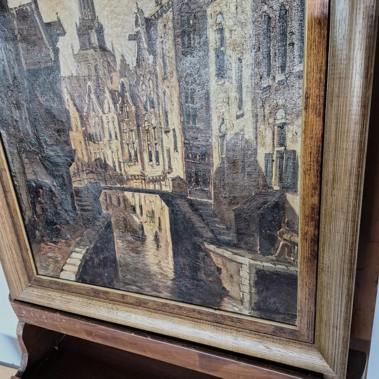Quadro com pintura óleo sobre tela, atribuído a C. Shuyler, obra intitulada "Paisagem Urbana com Canal".