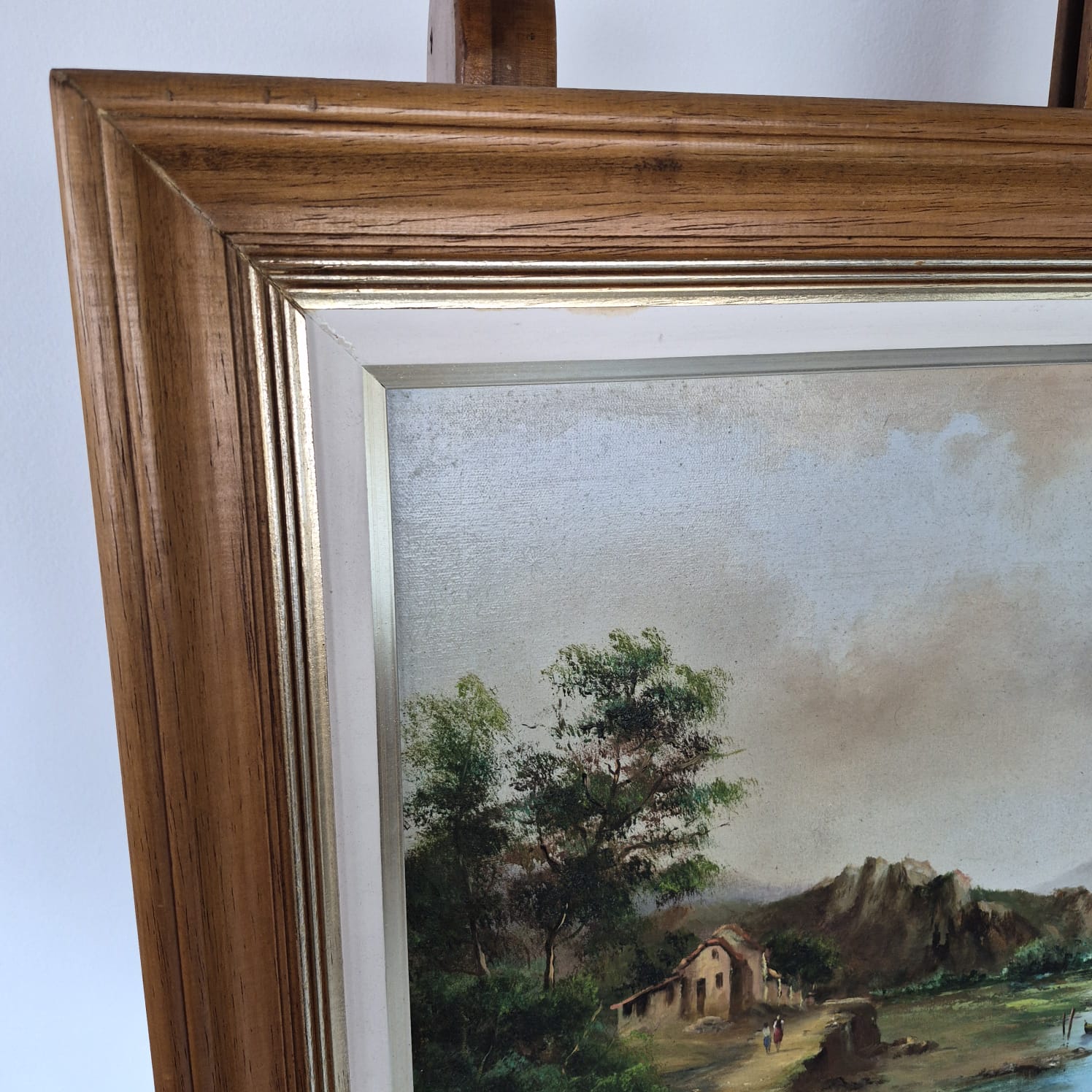 Quadro, pintura, óleo sobre tela, representando paisagem lacustre e casario, assinado frente e verso por Ivo Blasi.